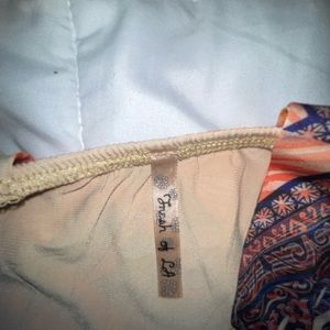 This is a long dress that flows at the bottom of your feet.